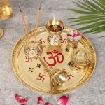 Two Moustaches 9 Inches Om & Swastika Design Brass Pooja Thali Set, Puja Aarti Thali Set, 1 Puja Thali, 1 Katori, 1 Agarbatti Stand, 1 Glass, 1 Puja Hand Bell, 1 Jyoti Diya, Multicolored, Pack of 6